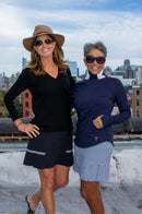 Golftini: Women's Black Side Pleat Performance Skort - Tornado